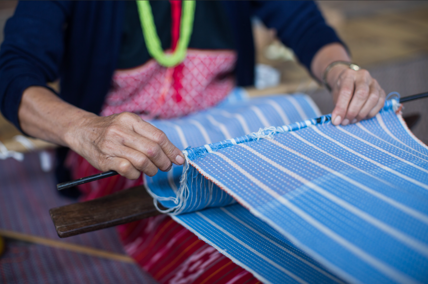 Woman working on creating the fabric for a table runner