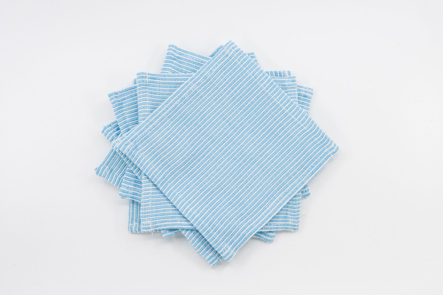 Set of blue and white stripped fabric coasters 